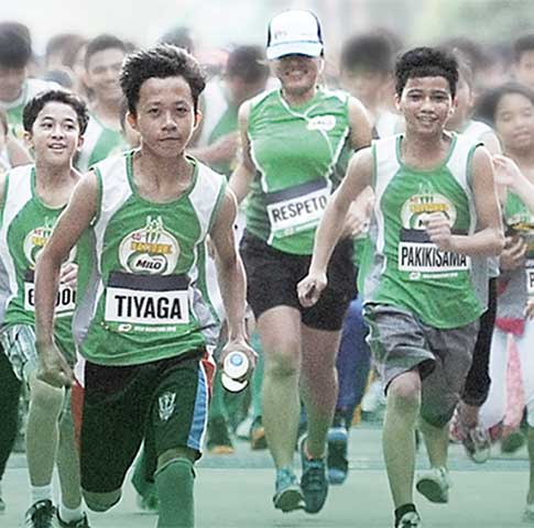 National Milo Marathon showing kids and adults wearing milo marathon uniforms running 