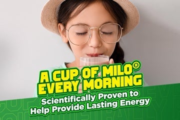 Young girl with glasses drinking a cup of milo every morning, scientifically proven to provide lasting energy